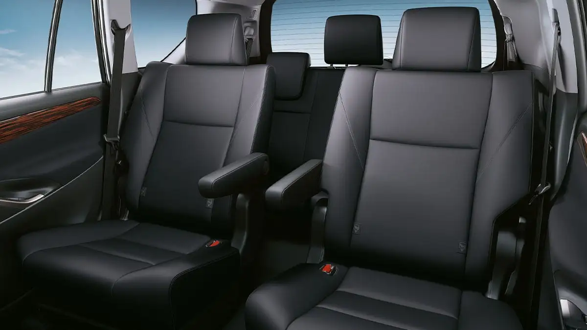 Toyota Innova second-row captain seats with premium black leather upholstery and armrest