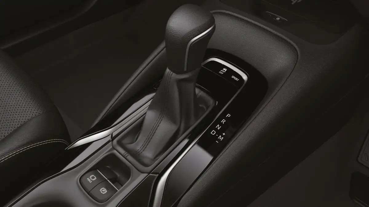Close-up of Toyota Corolla center console showing Continuously Variable Transmission gear selector and drive mode selection switches