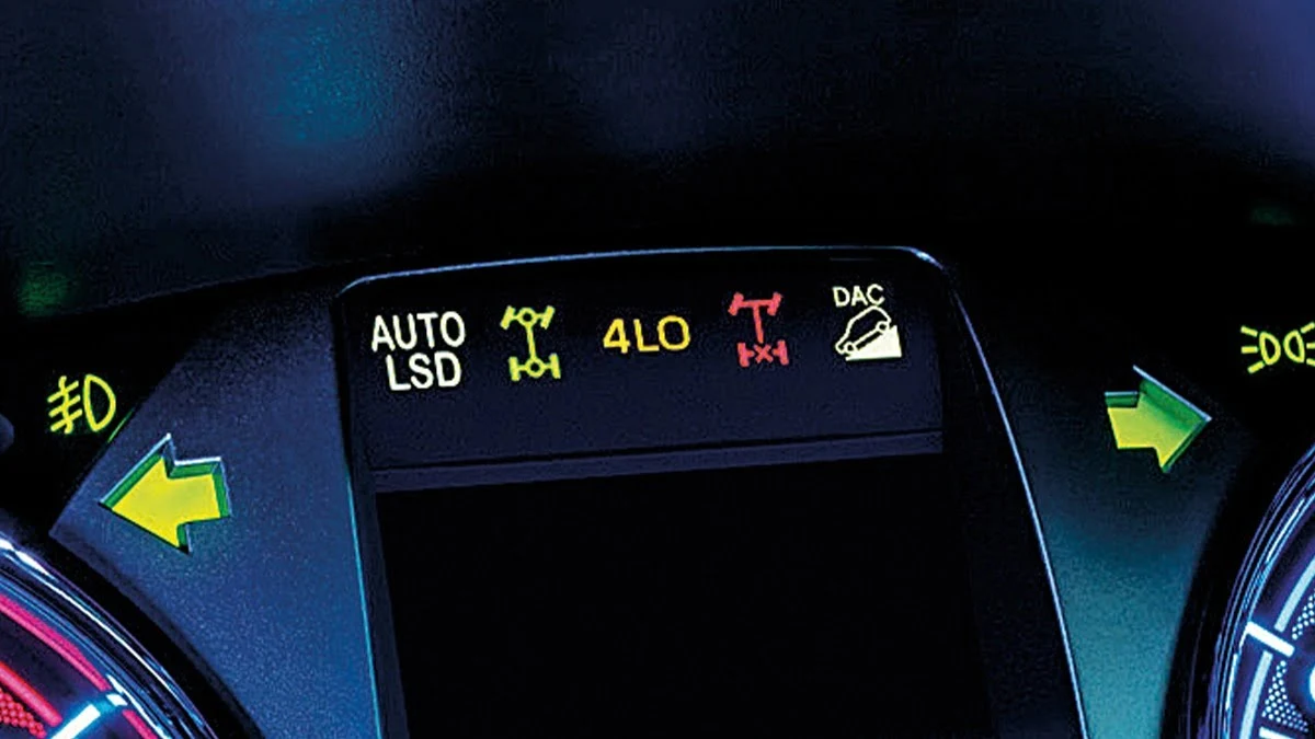 Toyota Hilux GR Sport dashboard display showing AUTO LSD, 4LO, and DAC warning lights with turn signal indicators