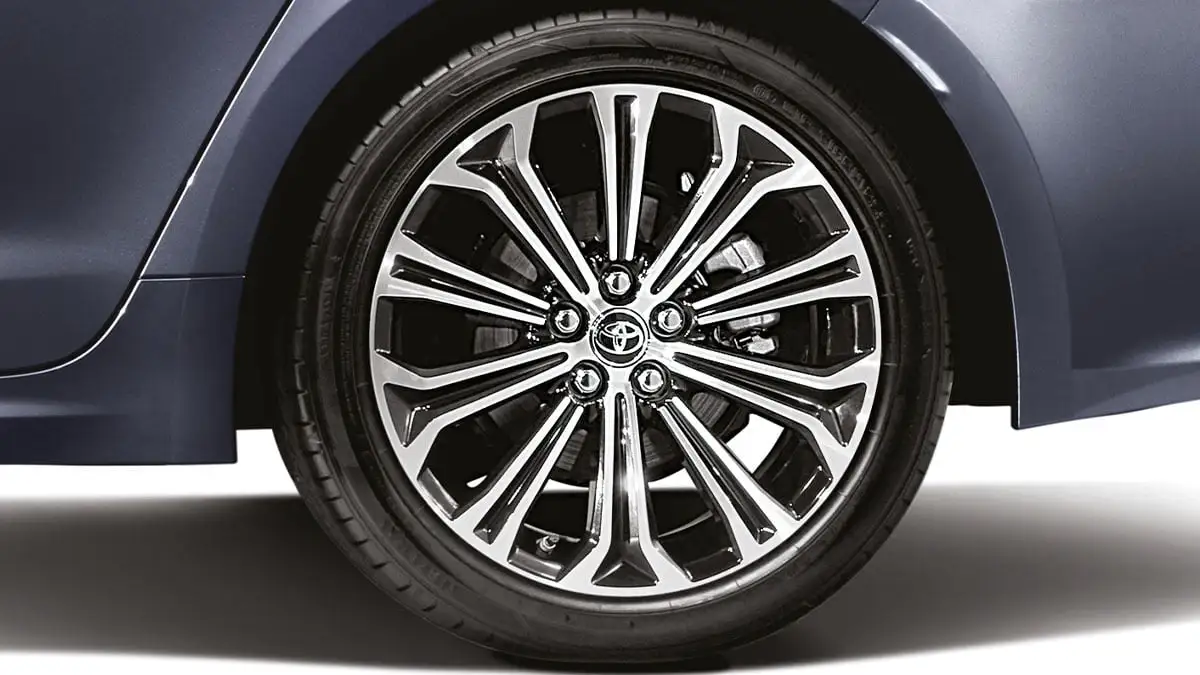 Detail shot of Toyota Corolla wheel featuring 17" alloy rim and premium tire branding