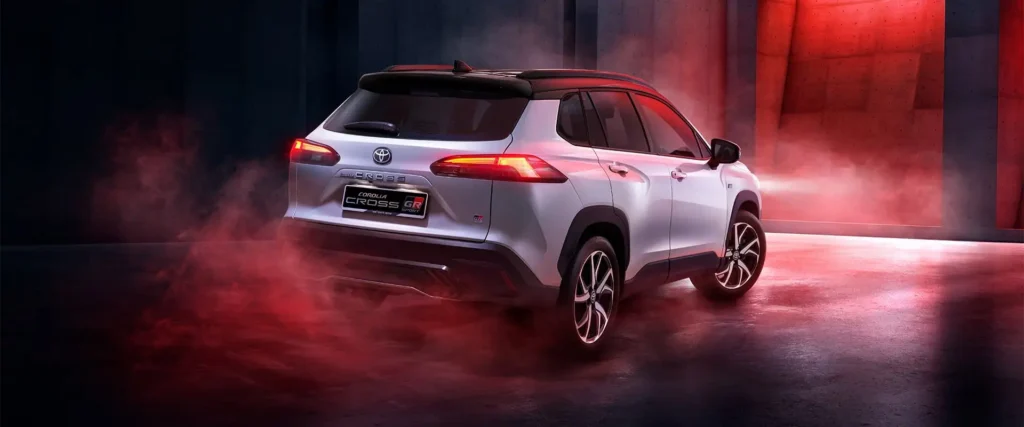 Toyota Corolla Cross GR Sport SUV positioned in modern showroom with dynamic shadows and contemporary backdrop