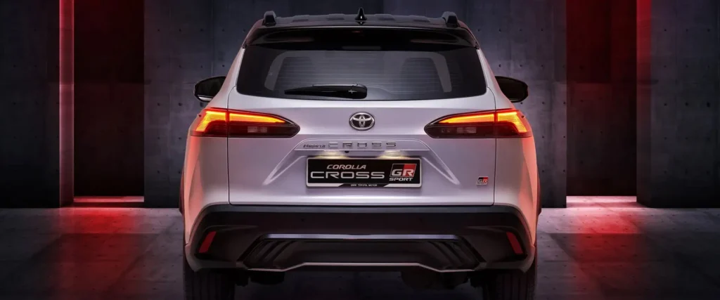 Back angle of Toyota Corolla Cross GR Sport displaying LED lighting technology and sporty rear spoiler design