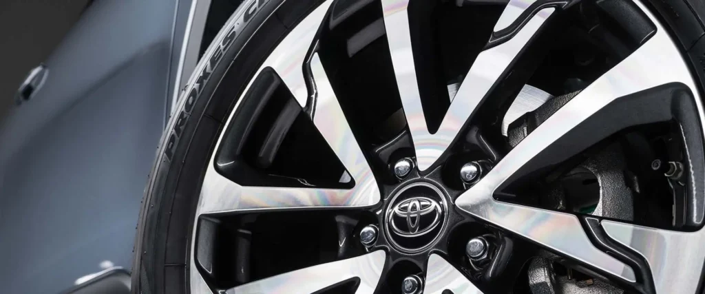 Toyota Corolla Cross Hybrid Electric alloy wheel detail showing multi-spoke design and brand center cap