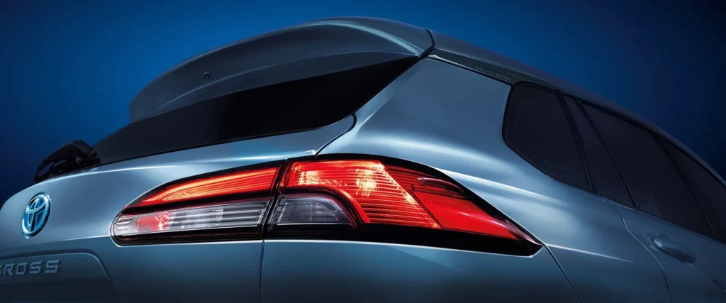 Toyota Corolla Cross Hybrid Electric rear taillight detail with LED technology and spoiler design element
