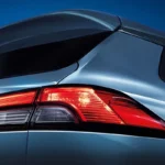 Toyota Corolla Cross Hybrid Electric rear taillight detail with LED technology and spoiler design element