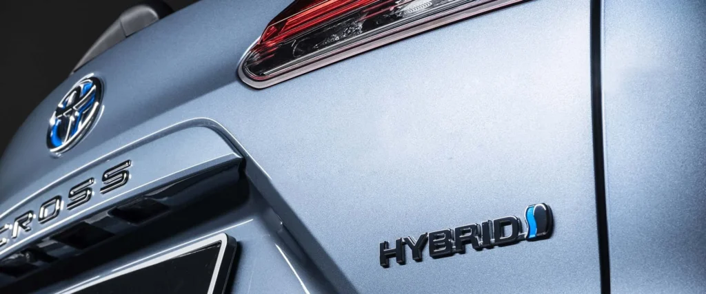 Toyota Corolla Cross Hybrid Electric body panel showing Cross and Hybrid badging with blue accent detailing