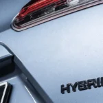 Toyota Corolla Cross Hybrid Electric body panel showing Cross and Hybrid badging with blue accent detailing