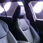 Toyota Corolla Cross Hybrid Electric front seats showing premium upholstery with natural sunlight streaming through windows