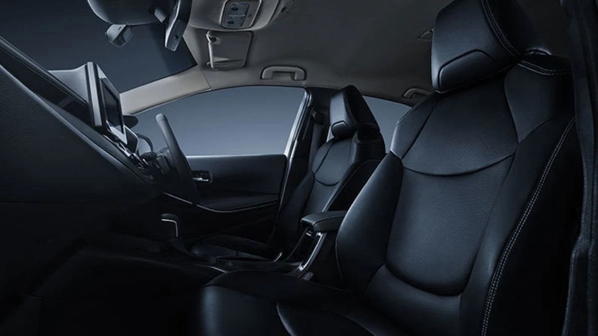 Toyota Corolla interior cabin view showing black leather seats and spacious passenger compartment design