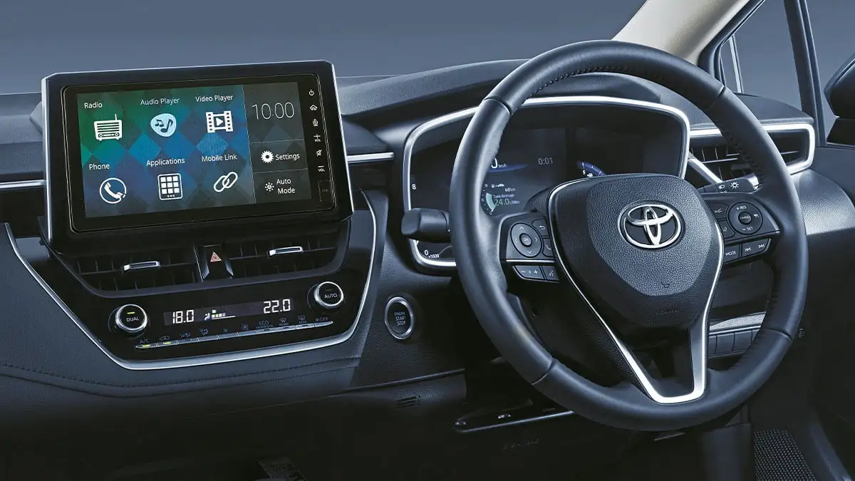 Toyota Corolla dashboard featuring touchscreen infotainment system with steering wheel controls and digital display