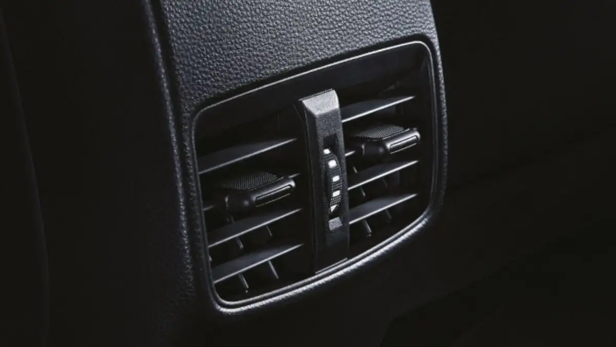 Toyota Corolla rear passenger air conditioning vent with adjustable directional louvers and climate contro