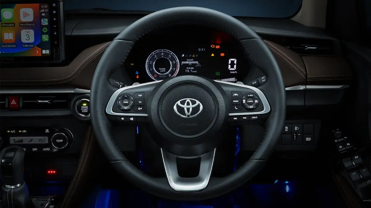 oyota Vios steering wheel with multifunctional controls and modern gauge cluster with digital readouts