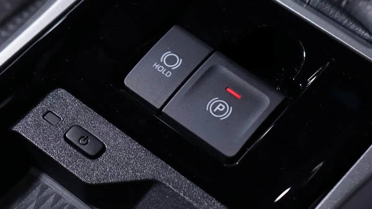 Toyota Veloz center console showing electric parking brake and brake hold function control buttons