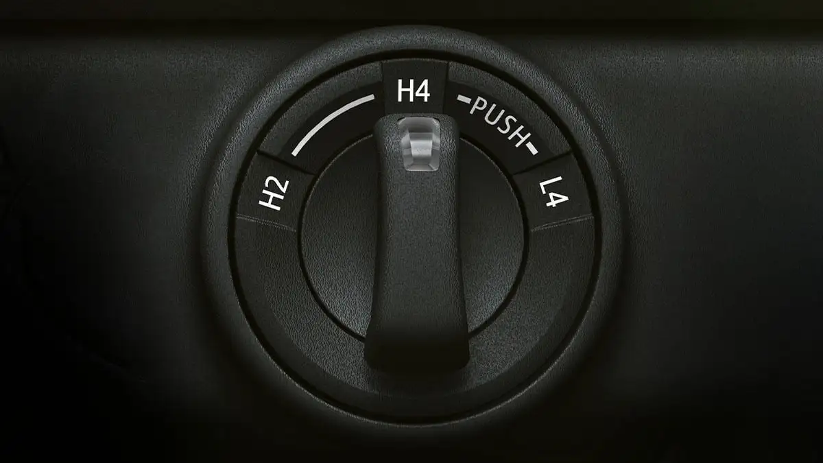 Toyota Fortuner 4WD transfer case dial showing H2, H4, and L4 drive mode selection switch on black dashboard