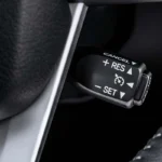 Close-up of Toyota Fortuner cruise control interface with ergonomic button layout and premium steering wheel design