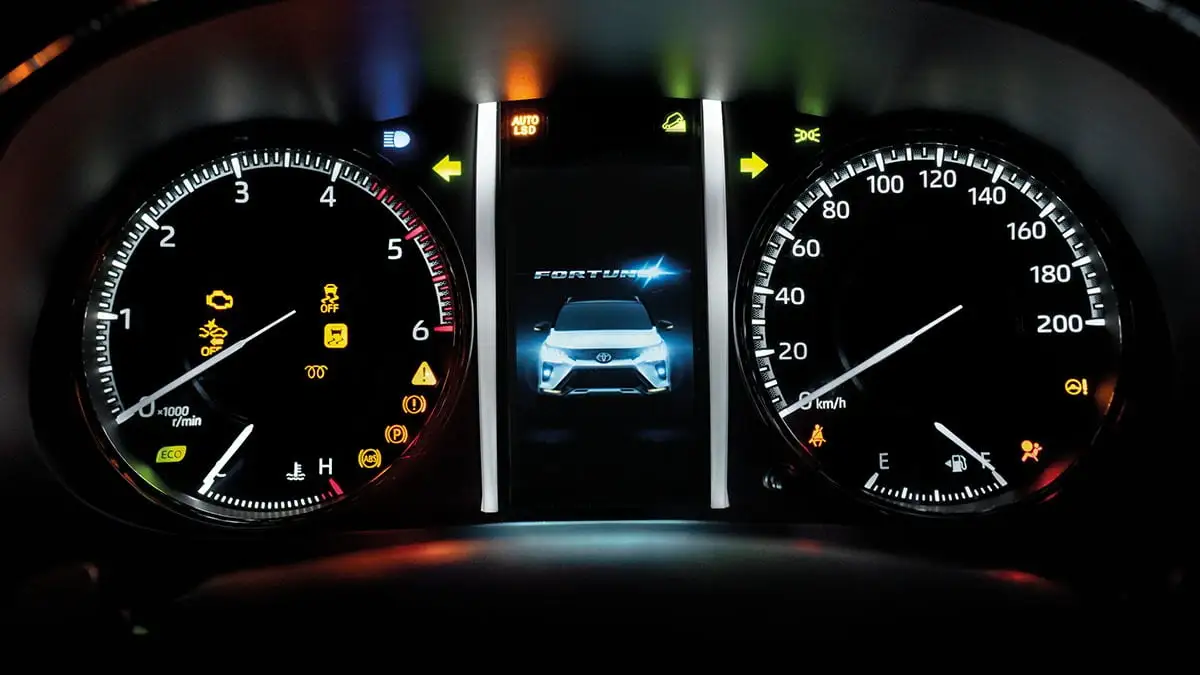 Toyota Fortuner Optitron meter cluster showing digital display with speedometer, tachometer and vehicle information