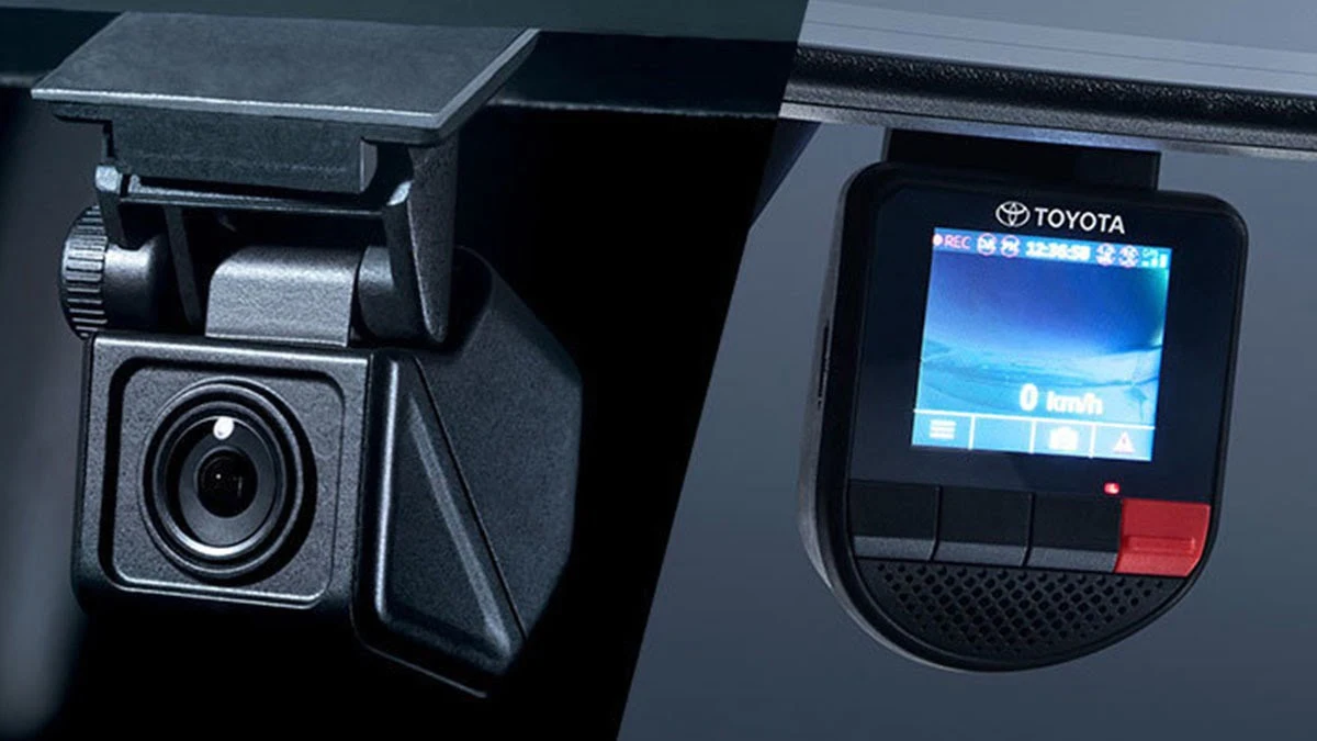 DVR dash cam setup in Toyota Corolla showing recording device with screen and integrated safety monitoring camera