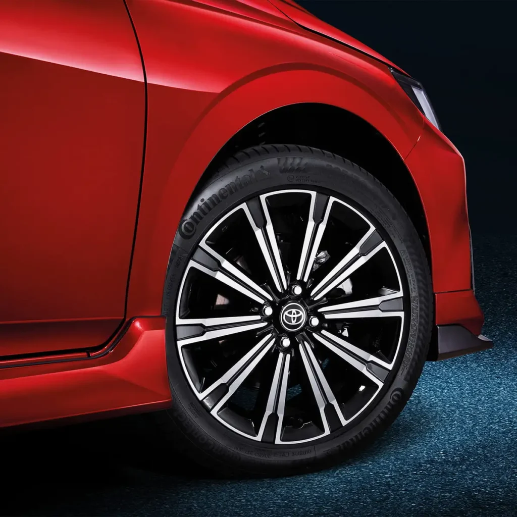 Toyota Vios red car wheel detail showing premium alloy rim design with spoke pattern and tire