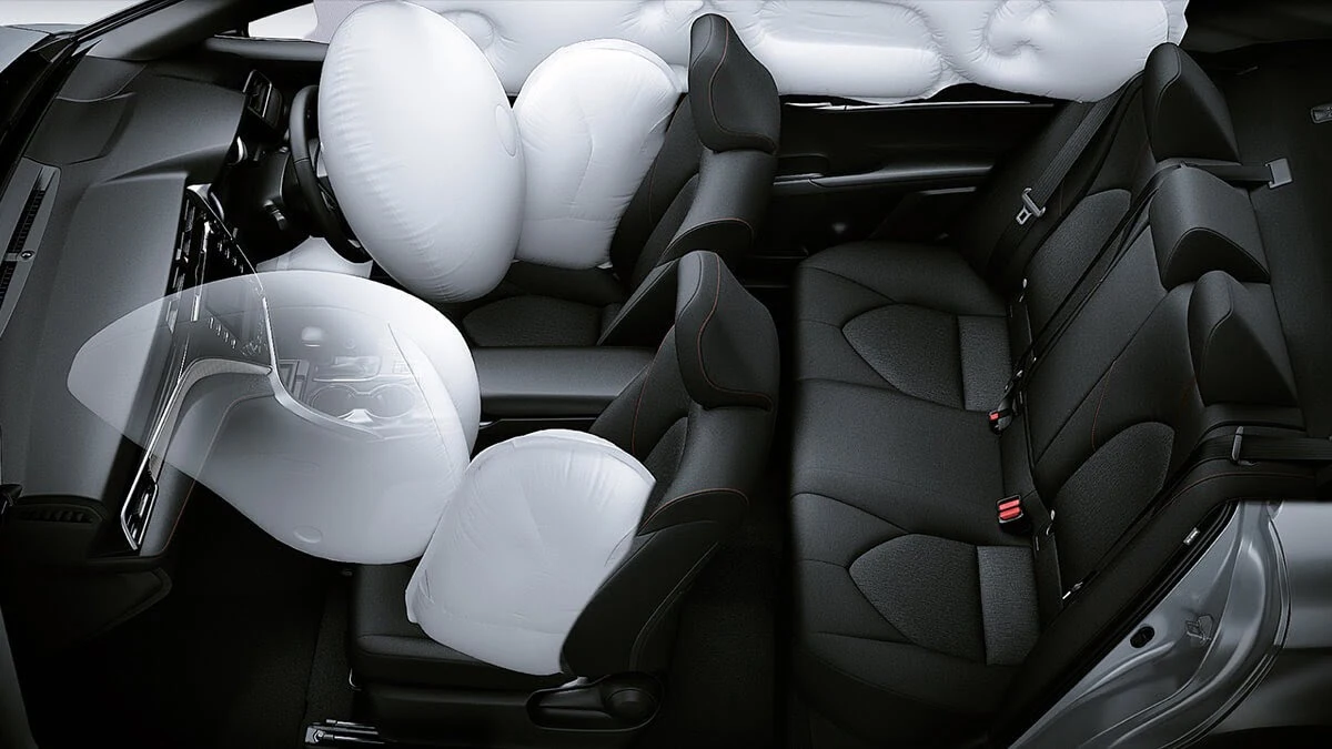 Toyota Harrier interior showing seven SRS airbag deployment with white airbags inflated throughout cabin for safety