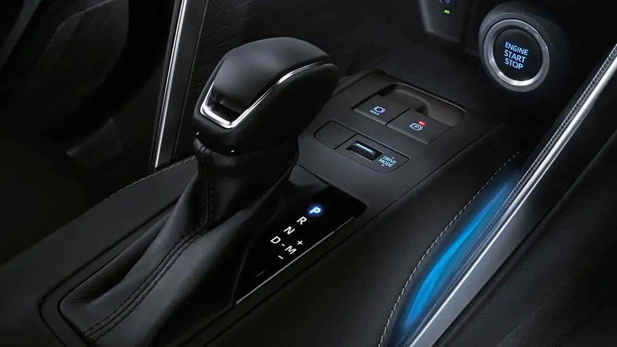 Toyota Harrier center console showing Continuously Variable Transmission (CVT) shifter with PRNDM controls and engine start button