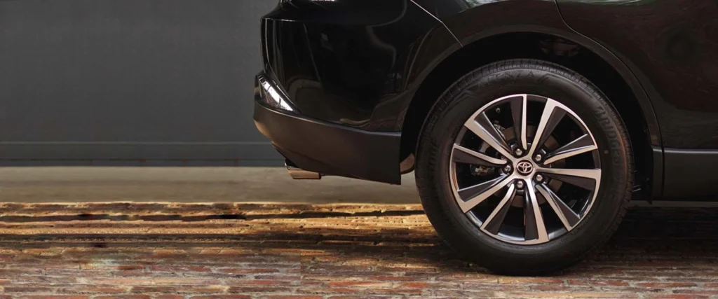 Close-up view of Toyota Harrier wheel featuring multi-spoke alloy rim design and performance tire setup