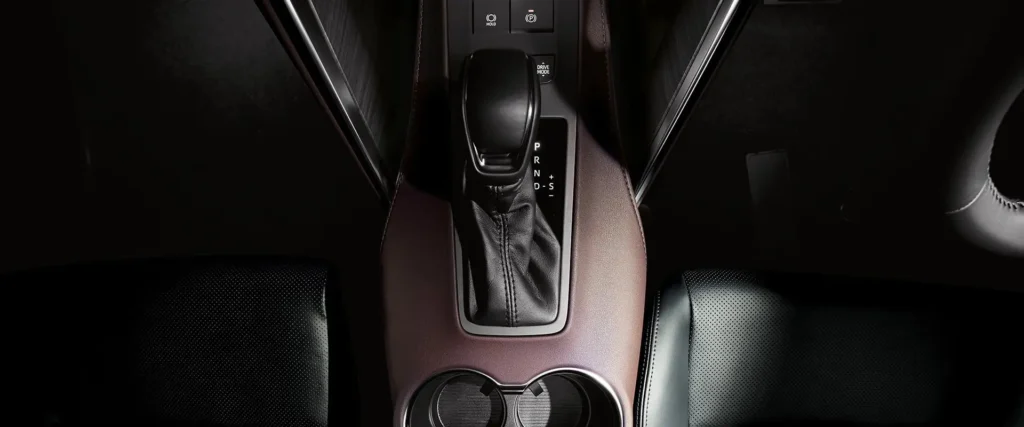 Toyota Harrier automatic transmission shifter with PRND controls and dual cup holders in center console
