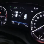 Toyota Harrier instrument cluster displaying speedometer, tachometer, and digital information screen with vehicle status