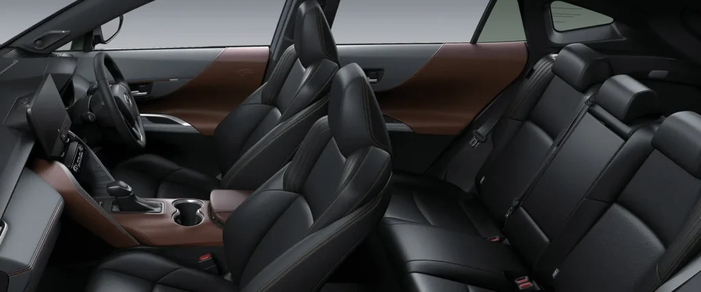 Toyota Harrier full interior view displaying black leather seats with brown trim and spacious cabin layout
