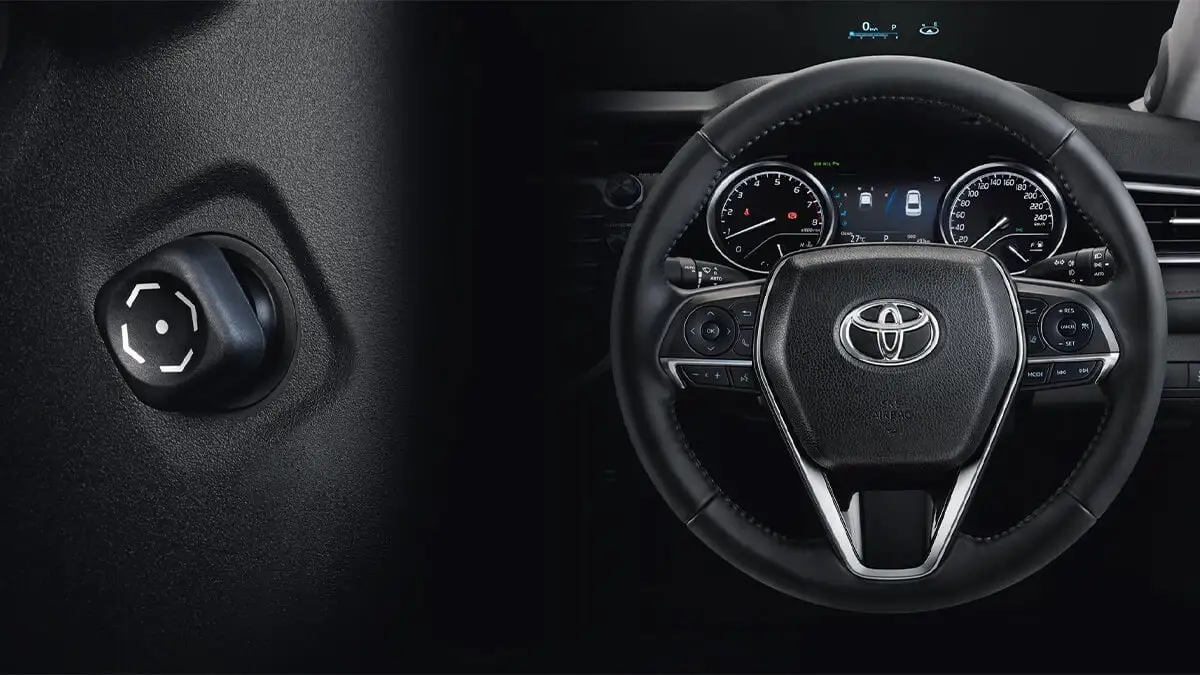 Toyota Harrier steering wheel with mounted controls and instrument cluster showing confident driving experience