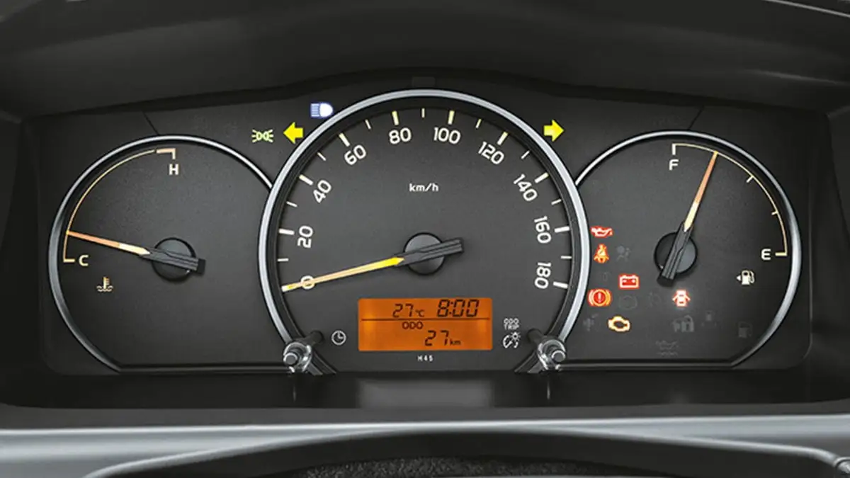 Toyota Hiace dashboard instrument cluster with three analog gauges and orange digital display showing vehicle data