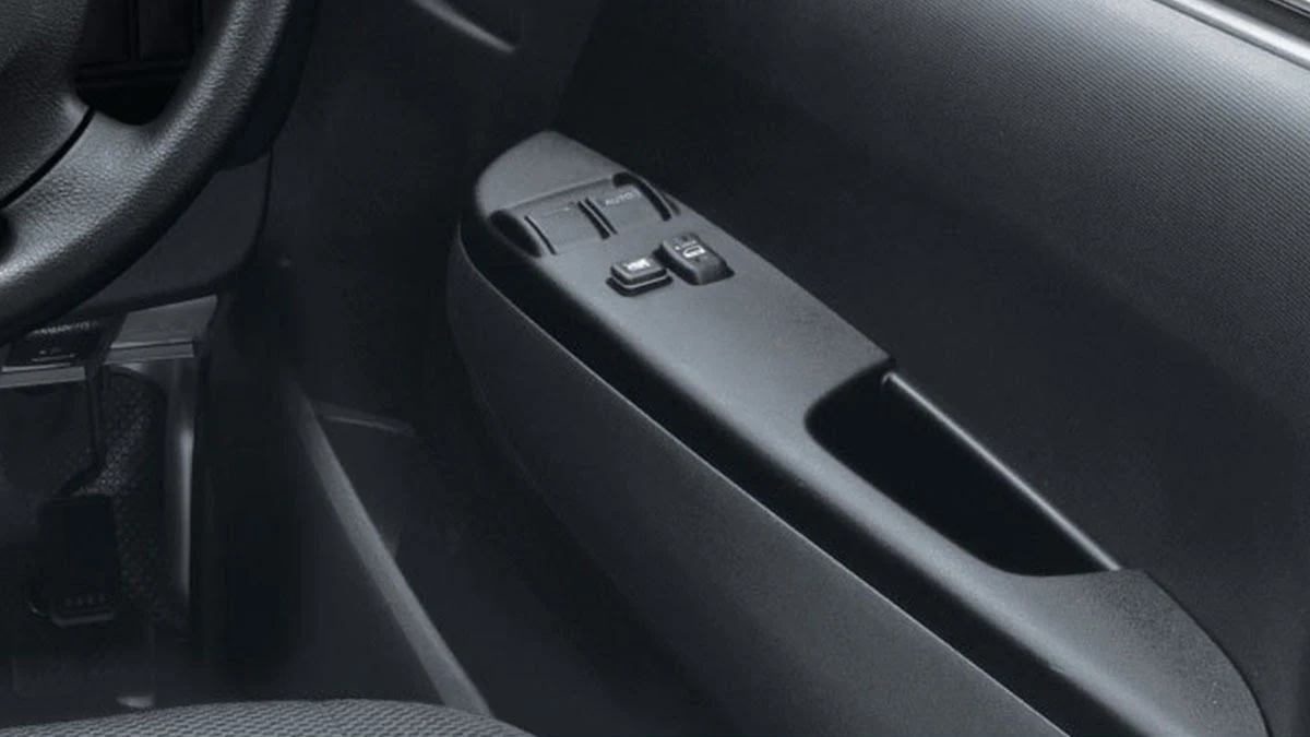 Toyota Hiace front door power window controls with two-button switch panel on black interior door panel