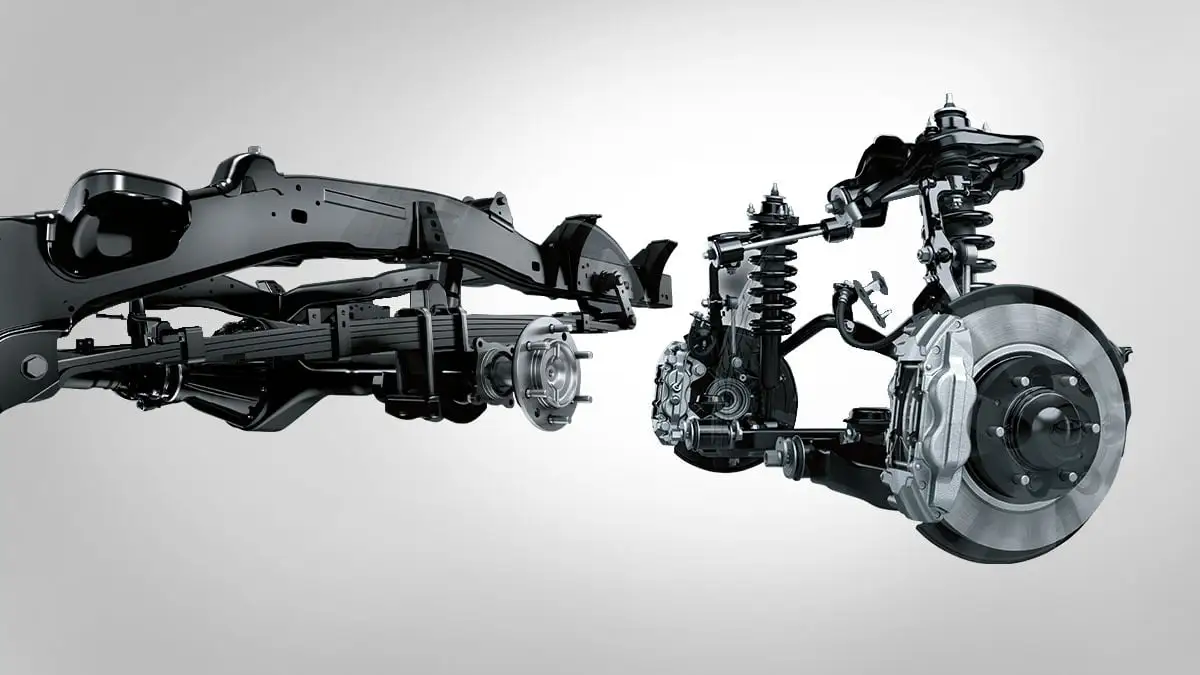 Toyota Hilux improved suspension assembly displaying shock absorbers, control arms, and drivetrain components for enhanced ride