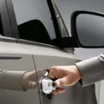 Exterior door handle of Toyota Innova with polished finish and integrated security features