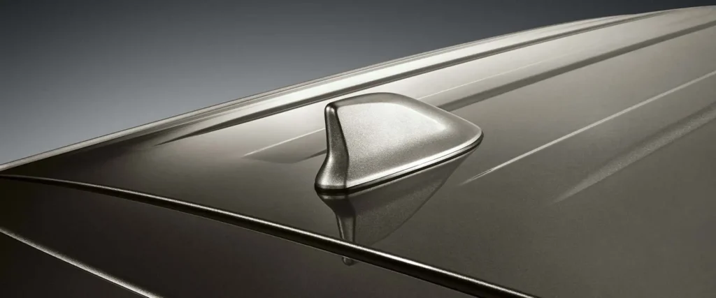 Modern roof-mounted antenna system on Toyota Innova featuring streamlined design