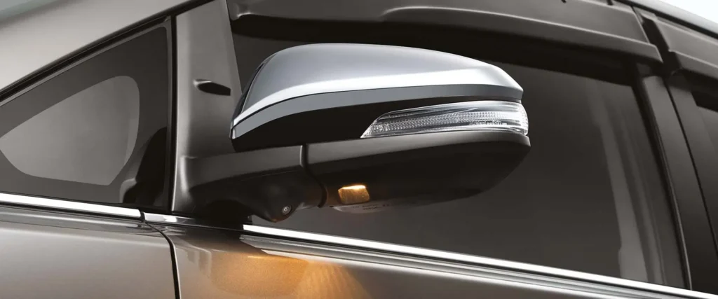 Toyota Innova side mirror with integrated turn signal and chrome accent for enhanced visibility and style