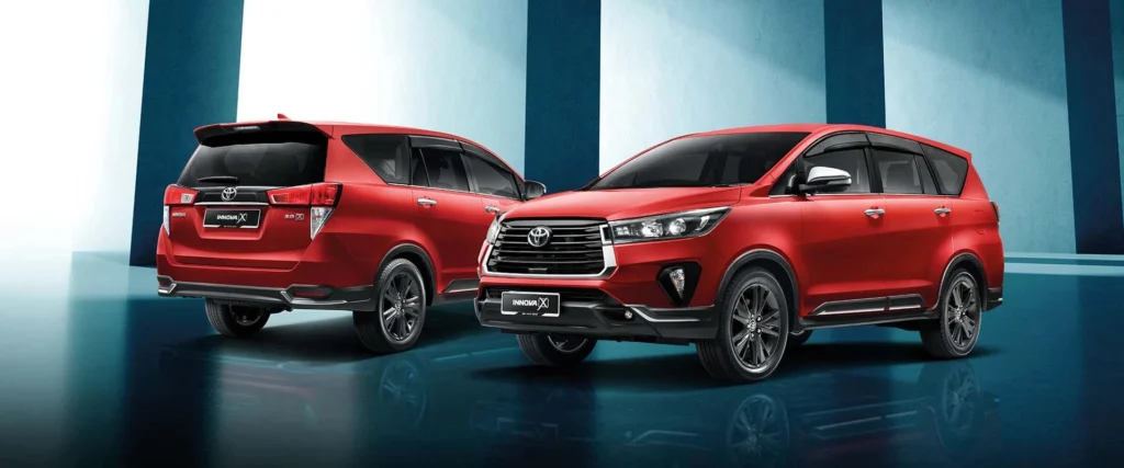 Red Toyota Innova front and rear view showcasing modern design with chrome grille and alloy wheels