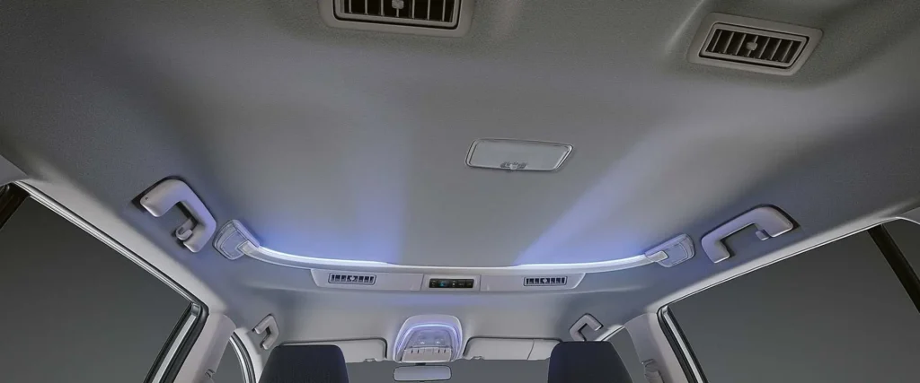 Toyota Innova roof console with ambient LED lighting and climate control vents for rear passenger comfort