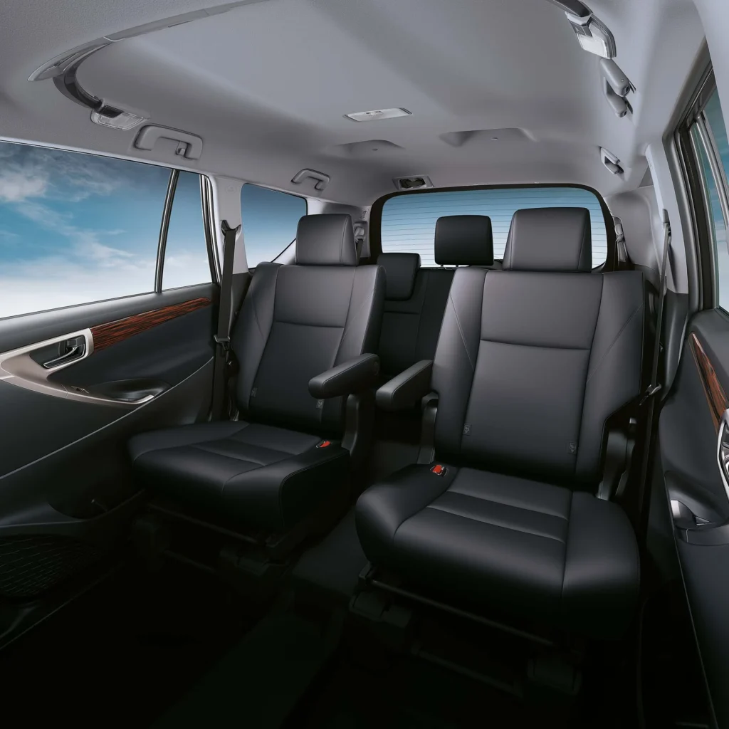 Spacious Toyota Innova cabin showing premium seating layout with multiple rows and natural lighting