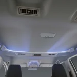 Toyota Innova roof console with ambient LED lighting and climate control vents for rear passenger comfort
