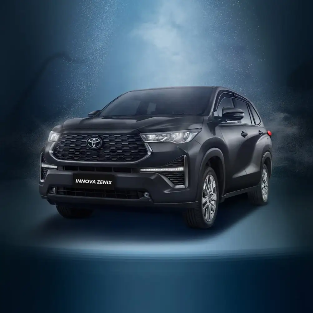Toyota Innova Zenix with modern design featuring chrome grille and alloy wheels on dynamic blue background