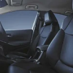 Toyota Corolla interior cabin view showing black leather seats and spacious passenger compartment design