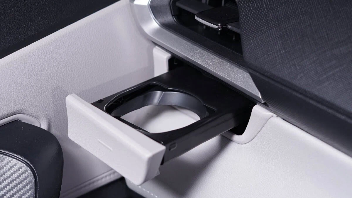 Multiple cup holder detail in Toyota Veloz showing practical storage solutions and modern design elements