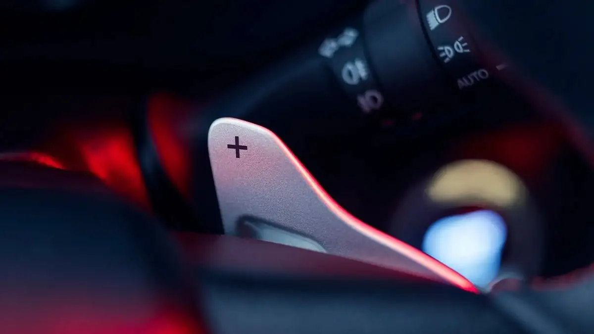 Toyota Hilux GR Sport steering wheel paddle featuring plus symbol for upshif