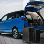 Blue Toyota Veloz with open tailgate displaying cargo space and travel luggage on concrete surfac