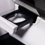 Car interior cup holder detail in Toyota Veloz showing practical storage solutions and modern design elements
