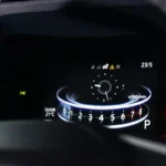 Toyota Veloz digital instrument cluster dashboard displaying speedometer, fuel gauge and warning indicators