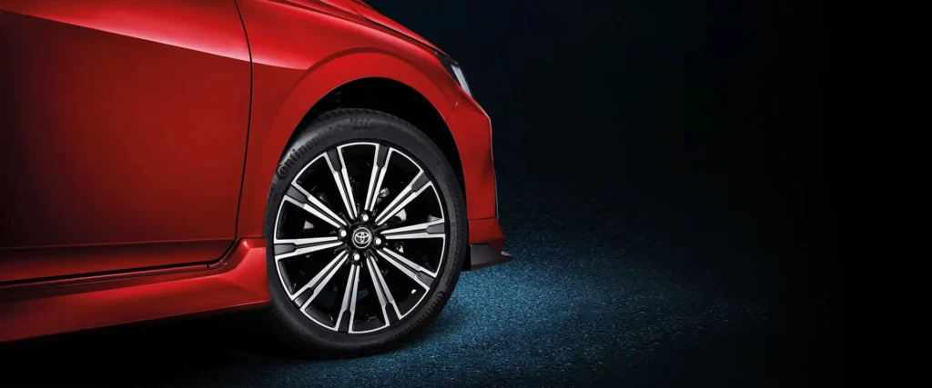Toyota Vios red car wheel detail showing premium alloy rim design with spoke pattern and tire