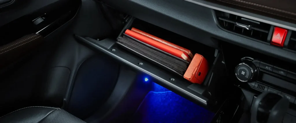 Car interior storage in Toyota Vios featuring practical compartment space with emergency items and lighting