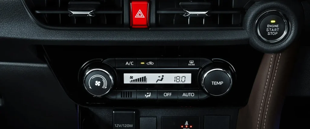 Car interior controls in Toyota Vios showing air conditioning panel and push-button engine starter