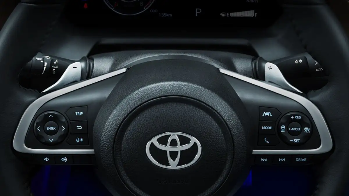 Toyota Vios steering wheel featuring paddle shifters with multifunctional controls and cruise control buttons